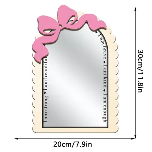 Wooden arched wall mirror featuring pink bow decor and motivational text details.
