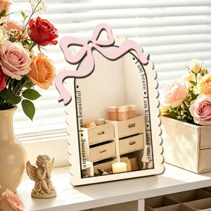Wooden acrylic decorative mirror with pink bow and inspiring quotes for bedroom desktop setup.