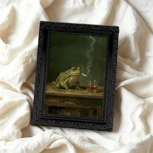 Vintage frog painting fridge magnet with black ornate frame detail view for home decor.