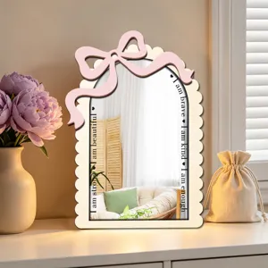 Wooden arch decorative mirror with pink bow and uplifting text for home bedroom decor.
