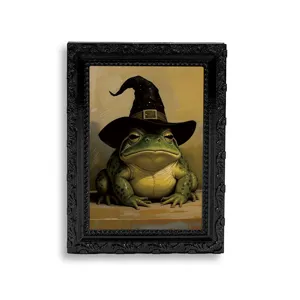 Close-up of the vintage picture frame fridge magnet featuring a funny frog in a witch hat.