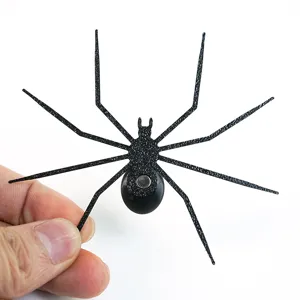 Close-up detail of 3D printed spider fridge magnet, perfect Halloween decor item.