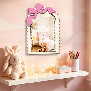 Wooden decorative wall mirror with cute pink bow and positive quotes for kids decor.