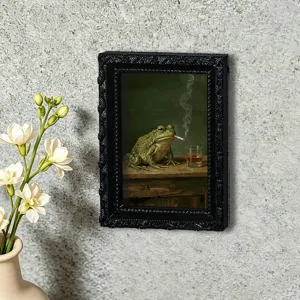 Vintage frog smoking art fridge magnet detail, retro black picture frame design, unique decor.