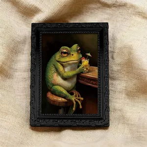 Nahaufnahme des Vintage-schwarzen Bilderrahmen-Kühlschrankmagneten mit witzigem Frosch-Design.