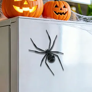 Close-up detail shot of a black 3D spider fridge magnet, perfect for Halloween party decor.