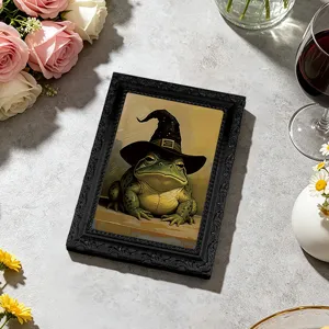 Close-up of a 3D magnetic fridge sticker featuring a funny frog in a retro frame design.