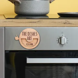 Wooden clean dishes magnetic sign detail view, durable kitchen reminder magnet for dishwasher.