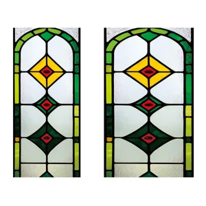 Stained glass window film detail showing arched geometric diamond pattern in green and yellow.