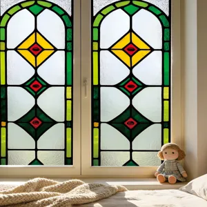 Close-up of stained glass window film featuring geometric patterns, vibrant colors and privacy.