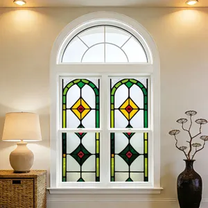 Stained glass window film detail showing vintage geometric colorful patterns in a bright home interior.