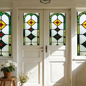 Detail view of stained glass window film on double doors, showing colorful light effects.