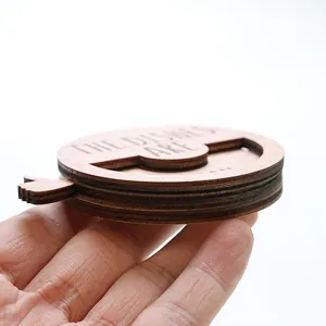 Wooden rotating pet status reminder sign detail view, magnetic decor board closeup.