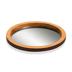 Détail de plateau miroir en bois rond, idéal pour la déco de fête et l'affichage de bougies.