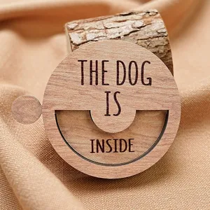 Wooden pet status sign detail shot showcasing the engraved text and natural texture clearly.