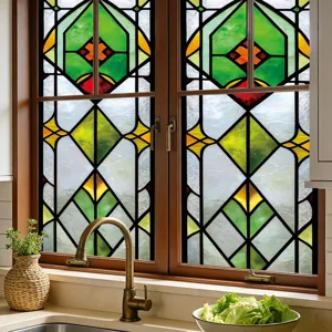 Detailed view of the colorful geometric stained glass window film applied on a kitchen window.