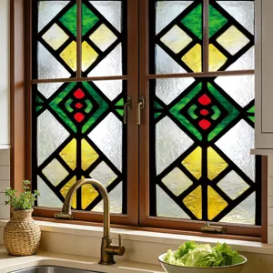 Detailed view of colorful geometric stained glass window film creating a retro privacy effect.