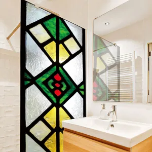 Stained glass window film detail showing vibrant geometric stained glass pattern in modern bathroom.
