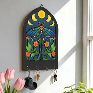 Wooden wall key holder with bohemian moth and moon phases art, detailed view of 4 hooks.