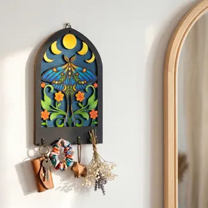 Bohemian wooden key holder wall mount with moon moth floral carving, decorative entry organizer.