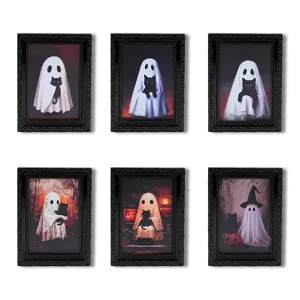 Detailed view of Halloween ghost fridge magnets, miniature black photo frames with cute spooky cat art.
