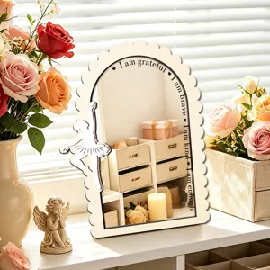 Wooden arched desktop mirror detail showing inspiring quotes and graceful ballerina decor.