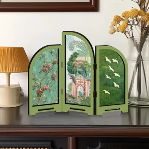 Detailed close-up view of the miniature folding screen with traditional floral and bird art.