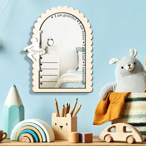 Wood arch mirror detail view in kids room with cute ballerina decor and positive English text.
