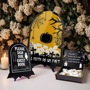 Halloween wedding guest book alternative with tombstone sign, drop box and wooden signature hearts.