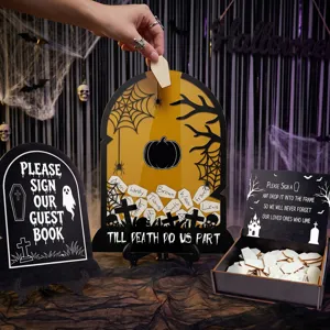 Halloween wedding guest book drop box detail showing wooden tombstone frame, sign and tokens.