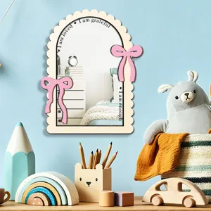 Wooden acrylic mirror for kids room wall decor with pink bows and motivational text.