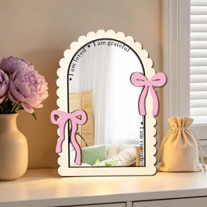 Wooden decorative mirror with pink bows and motivational quotes for desktop and room decor