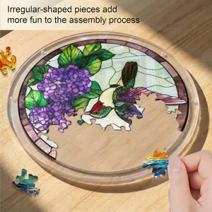 Round acrylic stained glass hummingbird puzzle window hanging suncatcher with irregular pieces.