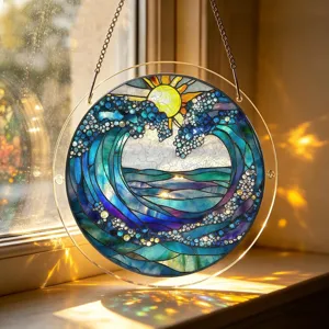 Close-up detail of a round acrylic stained glass suncatcher hanging ornament with ocean wave motif.