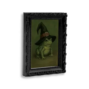 Retro black ornate frame frog wizard magnet detail shot, creative 3D fridge sticker decor.