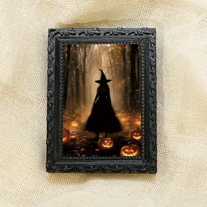 Close-up view of the vintage black Halloween magnetic photo frame with spooky ghost design.