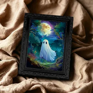 Close-up detail of the Halloween ghost fridge magnet frame with ornate black design.