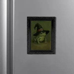 Close-up of the vintage black frame fridge magnet featuring a funny witch frog design.
