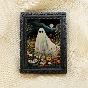 Close-up detail of the vintage black framed halloween ghost floral magnetic photo frame.