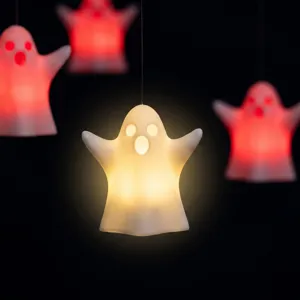 Detail shot of Halloween hanging LED ghost light, glowing decorative prop for holiday party.