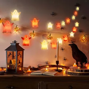 Detailed view of Halloween hanging LED lights with ghost and pumpkin string light ornaments.