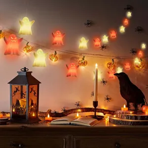 Halloween hanging LED ghost and pumpkin string lights for holiday indoor party decor.