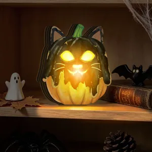 Detailed view of wooden Halloween pumpkin cat light-up ornament, perfect for festive home decor.