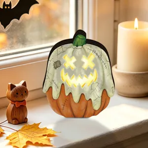 Halloween glowing wooden pumpkin decoration detail, vintage tabletop holiday decor closeup.