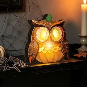Halloween wooden glowing owl pumpkin ornament detail view showcasing rustic holiday home decor.