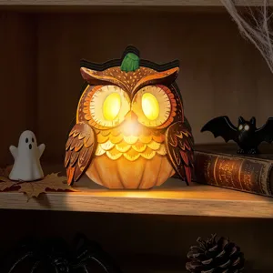 Detailed shot of the vintage wooden owl LED light ornament for Halloween decor setup.