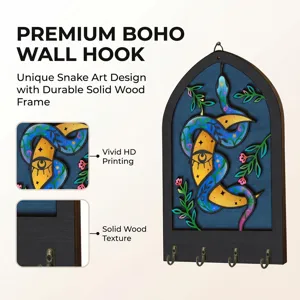 Detailed view of the boho wooden wall key hook featuring unique snake art and metal hooks.