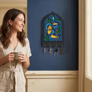 Bohemian wooden key holder wall decor, vintage mystical snake design with four hooks for home.