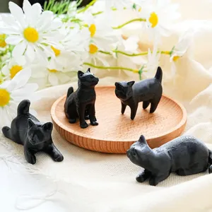Detailed closeup of 3D printed black cat fridge magnets set showing cute poses and texture.