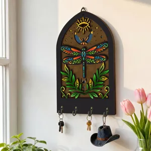 Bohemian wooden wall key holder with mystical dragonfly design for home decor detail view